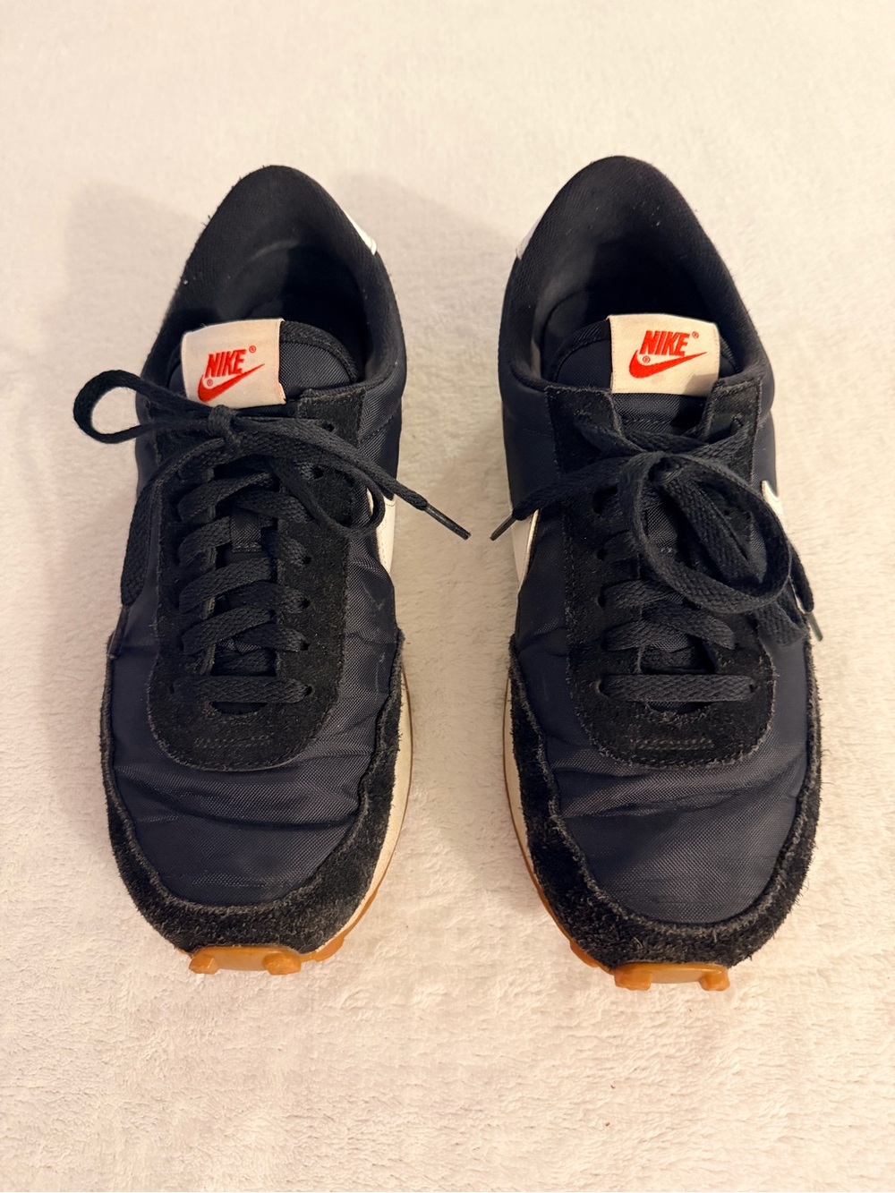 Nike Women’s Black Sneakers with White and Orange Accents